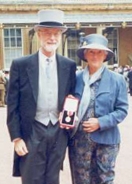 C.A.R. Hoare and his wife stand outside Buckingham Palace after he was knighted by the queen